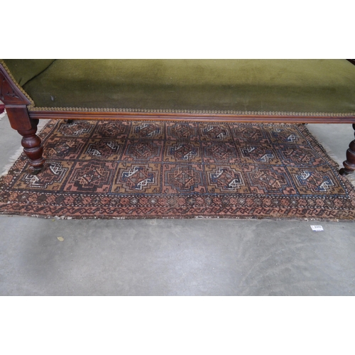 2255 - A small Eastern blue brown and orange rug, 91cm x 142cm