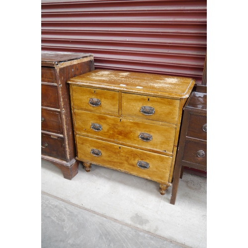 2299 - An early 20th Century country oak chest of two short over two long drawers, on turned supports