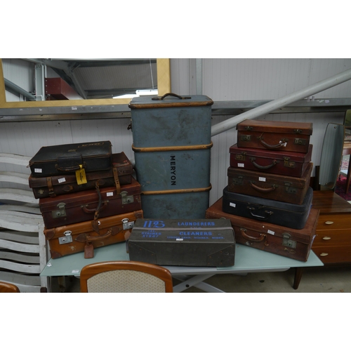 2316 - A shipping trunk, various vintage suitcases, mainly leather and a laundry case