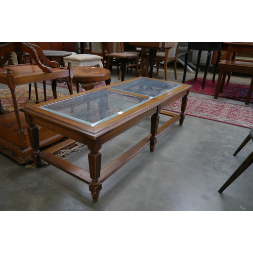 2340 - A bevelled edge glass top coffee table    (E) £15-20