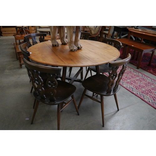 2341 - A dark Ercol cross stretcher table with six Ercol chairs   (R) £60