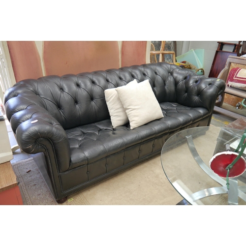 2352 - A Black Chesterfield style sofa