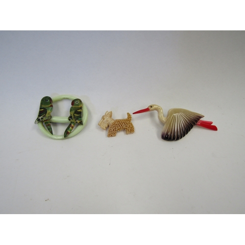 1269 - A French Celluloid Stork brooch together with a Celluloid Parrot brooch and a Scottie brooch (3)