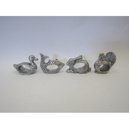 1271 - Four white metal serviette rings in the form of a Hen, Fish, Duck and Rabbit