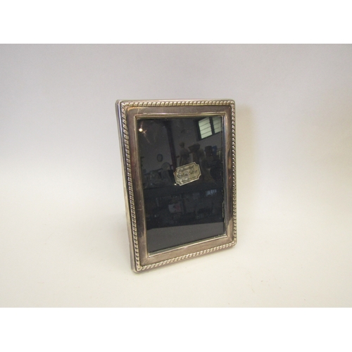 1284 - A silver photograph frame, Sheffield 1989, height approximately 16cm