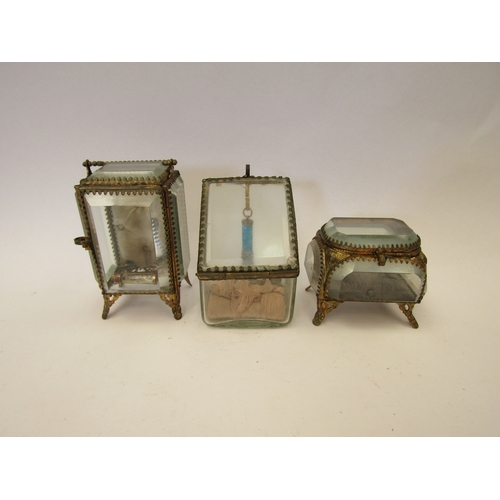 1309 - Three early 20th Century ormolu and glass jewellery caskets/boxes of varying forms and another (4)