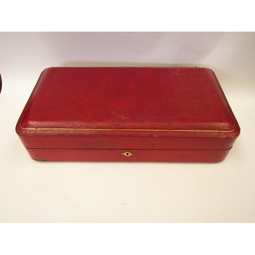 1315 - A Mappin & Webb silver vanity set in red leather case