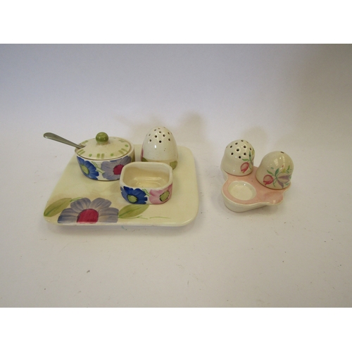 1318 - Two Susie Cooper condiment sets, one shaker missing