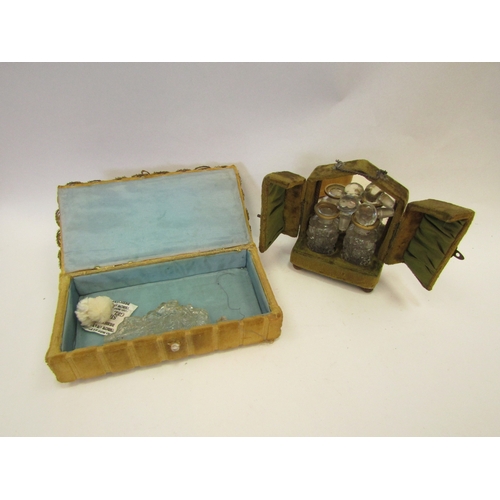 1336 - A velour coloured perfume casket, opening to reveal a mirrored interior with two bottle contents and... 