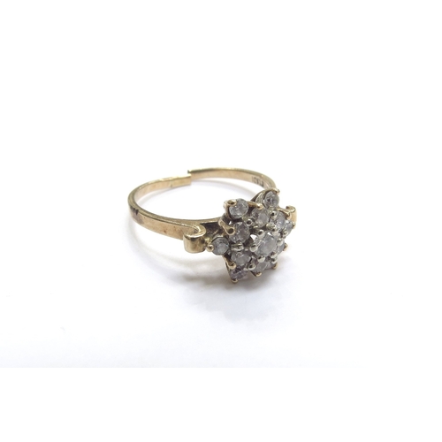 9405 - A diamond cluster ring, stamped 10k, shank split. Size N, 2.3g      (E) £150-200