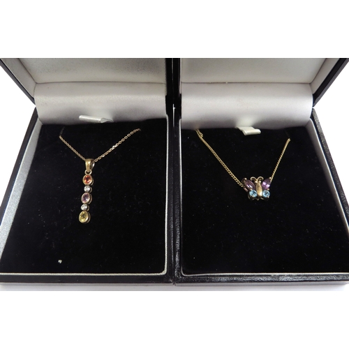 9408 - A diamond and multi coloured stone pendant hung on 9ct gold chain and a topaz and amethyst butterfly... 