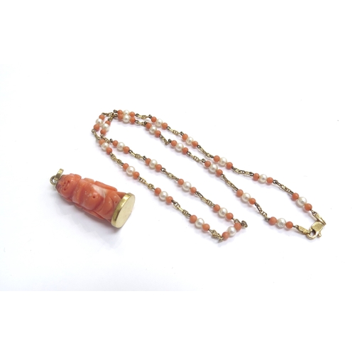 9244 - A coral and pearl bead gold necklace stamped 14k, 40cm long with a carved coral Buddha pendant