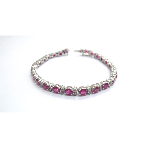 9203 - A ruby and old cut diamond bracelet, unmarked metal, 18cm long