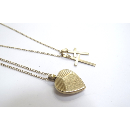 9222 - A 9ct gold heart shaped locket hung on 9ct gold chain, 46cm long and two 9ct gold cross pendants hun... 