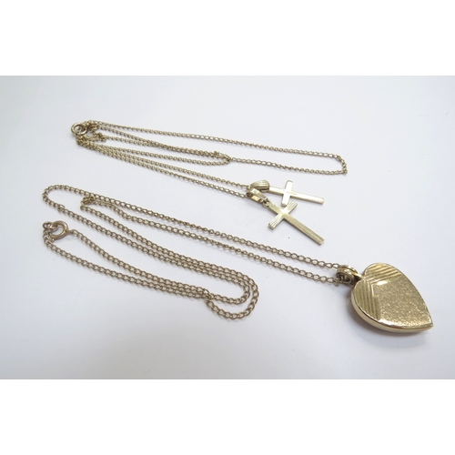 9222 - A 9ct gold heart shaped locket hung on 9ct gold chain, 46cm long and two 9ct gold cross pendants hun... 