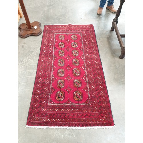 2254 - A Persian hand woven red and black runner rug, 101cm x 190cm   (R) £150