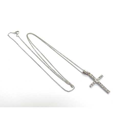 9046 - A 9ct white gold diamond set cross pendant hung on a white gold chain, 375, 50cm long, 1.9g