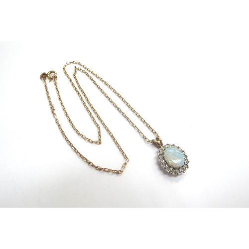 9017 - A 9ct gold opal and diamond cluster pendant hung on a 9ct gold chain, 46cm long, 4.4g total