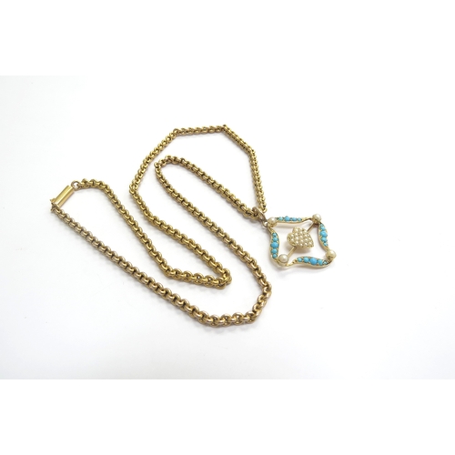 9061 - A turquoise and seed pearl open pendant with a central heart motif, stamped 15ct hung on a gold chai... 