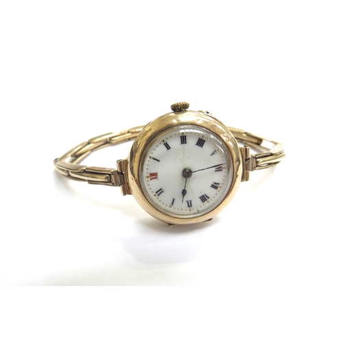 9087 - A 15ct gold cased wristwatch with plated sprung strap, 22.8g total