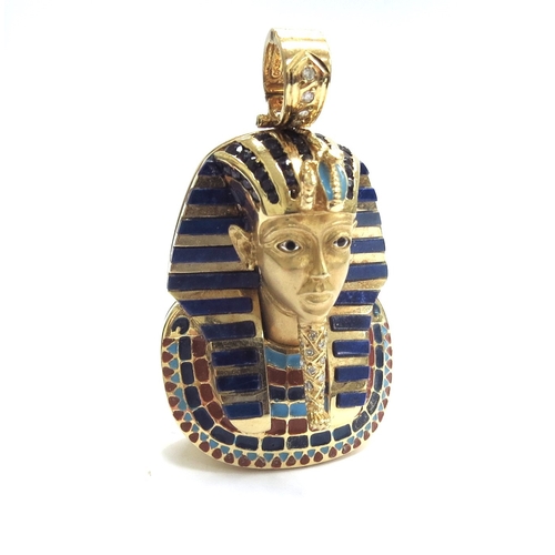 9162 - A gold and enamelled pendant of Tutankhamun with sapphires to headdress and diamonds to beard and ba... 