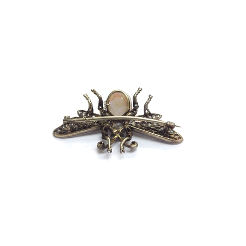 9024 - An Edwardian brooch as a Bee, the ruby eyes on a diamond set thorax and oval opal abdomen, the wings... 