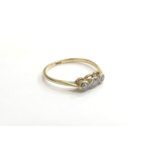 9242 - A three stone diamond ring in rubover setting, stamped 28ct. Size R, 2g   (C)