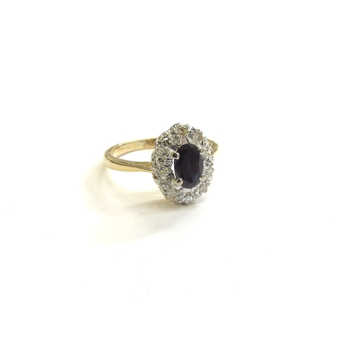 9172 - An 18ct gold sapphire and diamond cluster ring. Size J/K, 2.8g   (C)