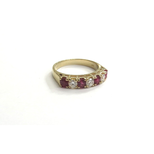 9315 - A 14ct gold diamond and ruby seven stone half hoop ring. Size P, 4.4g       (C)