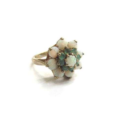 9220 - A 9ct gold opal and emerald daisy cluster ring. Size L/M, 5.7g   (C)