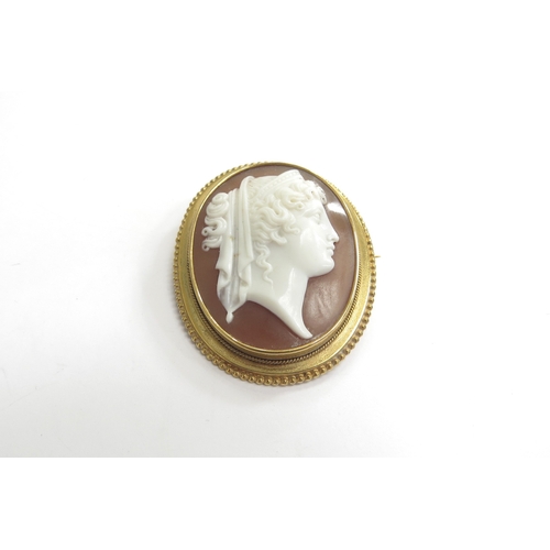 9218 - A finely carved shell cameo brooch, profile of female in unmarked gold frame, 4cm x 3.3cm, 8.9g   (C... 