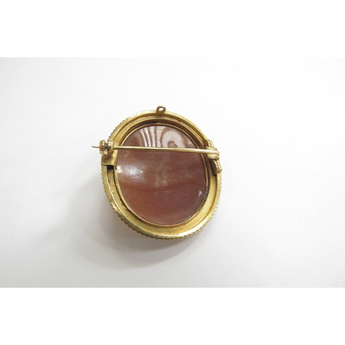 9218 - A finely carved shell cameo brooch, profile of female in unmarked gold frame, 4cm x 3.3cm, 8.9g   (C... 