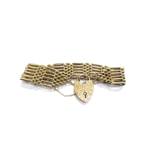 9197 - A 9ct gold textured link gate bracelet with an engraved padlock clasp, 26.2g