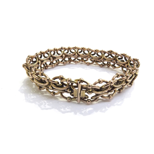 9181 - A gold spring link bracelet, stamped 9ct, 17.3g total