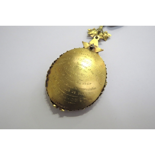 9443 - An 18ct gold Masonic medal, 