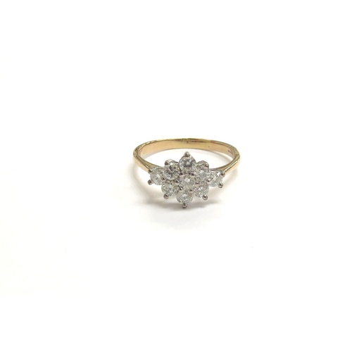 9309 - An 18ct gold diamond cluster ring. Size V/W, 4.5g           (C)