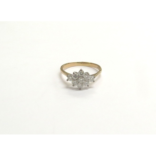 9309 - An 18ct gold diamond cluster ring. Size V/W, 4.5g           (C)