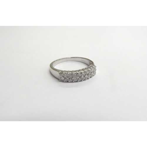 9336 - An 18ct white gold two row diamond ring. Size O, 3.9g           (C)