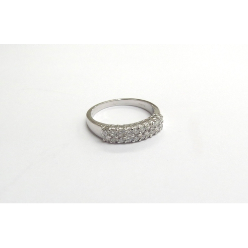 9336 - An 18ct white gold two row diamond ring. Size O, 3.9g           (C)