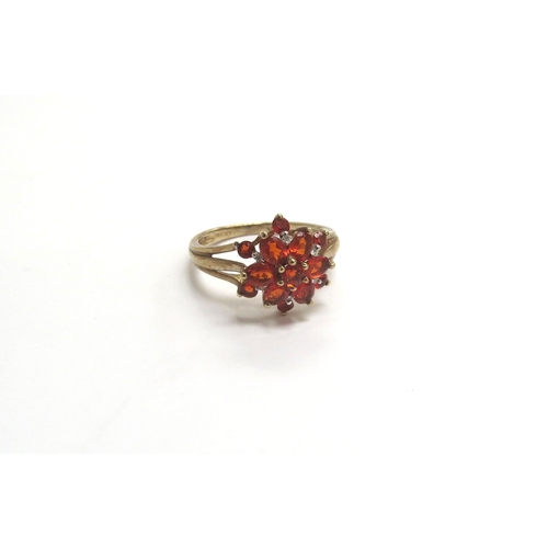 9334 - A 9ct gold fire opal and diamond cluster ring. Size Q, 2.8g    (C)