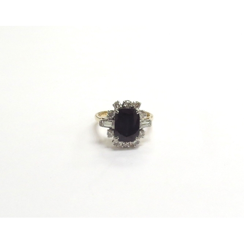 9137 - A sapphire and diamond cluster ring, the central sapphire 10mm x 7mm framed by brilliant cut diamond... 