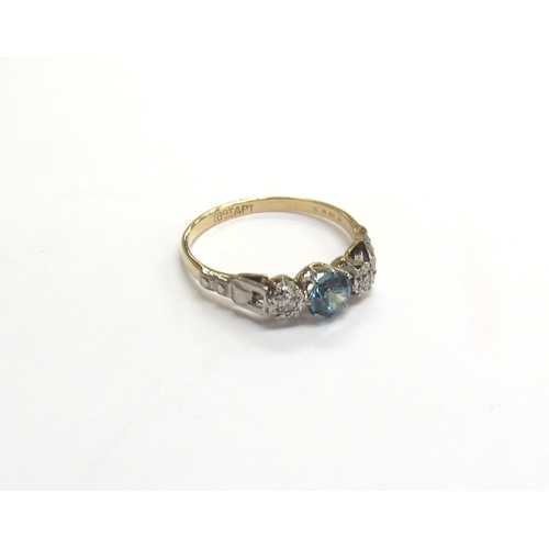 9212 - An 18ct gold platinum set ring centrally set with a blue zircon flanked by small diamonds. Size Q, 2... 