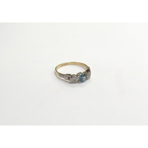 9212 - An 18ct gold platinum set ring centrally set with a blue zircon flanked by small diamonds. Size Q, 2... 