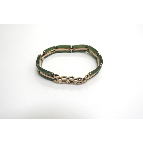 9338 - A gold and jade panel bracelet, expanding sprung strap stamped 9ct, 13.9g total           (C)