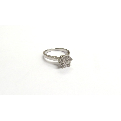 9314 - A 9ct white gold illusion set diamond cluster ring. Size H/I, 2.6g       (C)