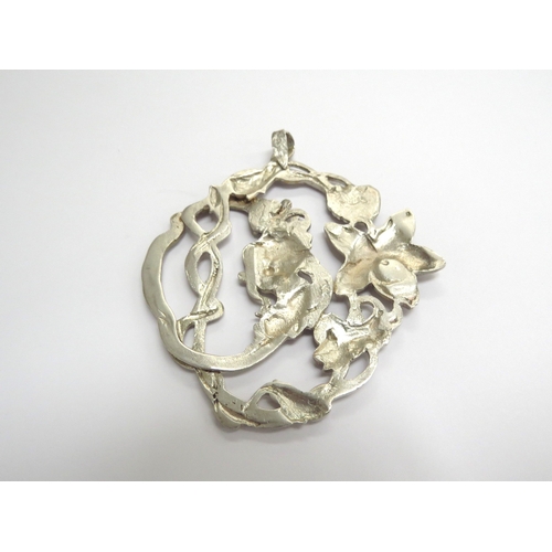 9260 - An Art Nouveau silver pendant depicting female in flower and vines, Birmingham 1901, 7.5cm x 6.7cm, ... 