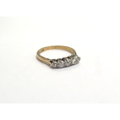 9233 - An 18ct gold platinum set five stone graduated diamond ring. Size P/Q, 3g   (C)