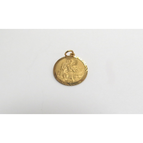 9230 - A 9ct gold St Christopher pendant, 1.8cm diameter, 2.4g