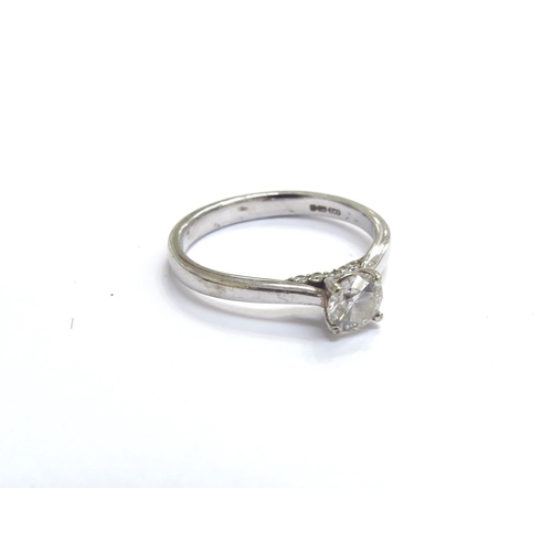 9449 - A 9ct white gold diamond solitaire 0.40ct with diamond set bezel. Size L, 2.2g, with certificate Col... 