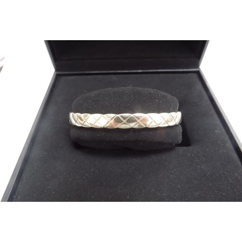 9450 - A Chanel Coco Crush bracelet, 18ct gold quilted design, 6mm width, boxed with Certificate of Authent... 